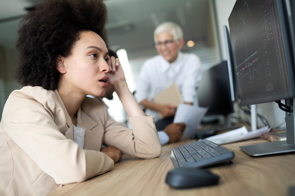 Confused woman looking at company reports